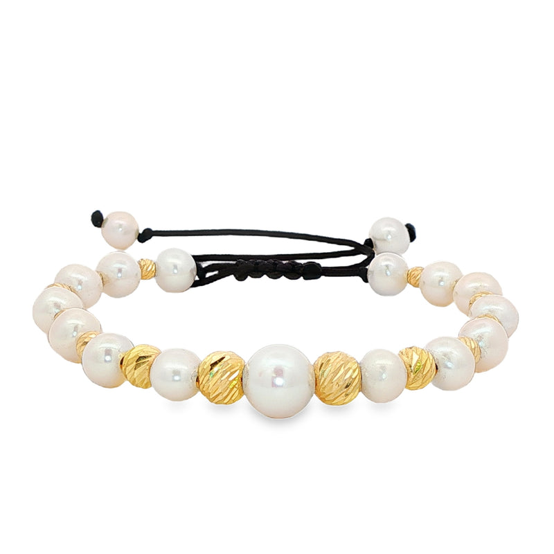 Unisex pearl bead bracelet with gold accents and adjustable black cord closure.