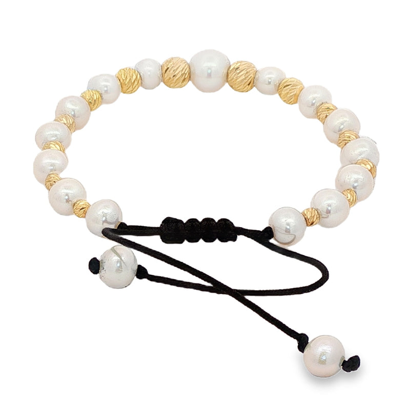 Unisex pearl bead bracelet with gold accents and adjustable black cord closure.