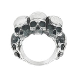 Silver skull ring with three detailed skulls and a matte finish, bold men’s jewelry design.