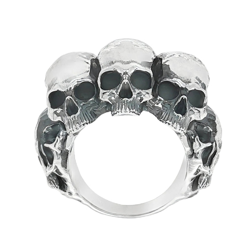 Silver skull ring with three detailed skulls and a matte finish, bold men’s jewelry design.