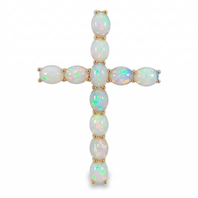 Yellow gold cross pendant with oval opal gemstones in a vertical and horizontal arrangement