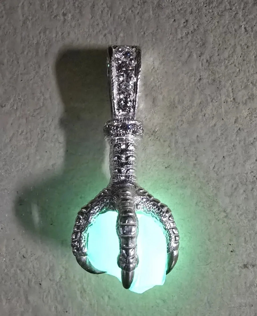Glow-in-the-dark claw pendant on Franco chain, worn by ThetaGuardian