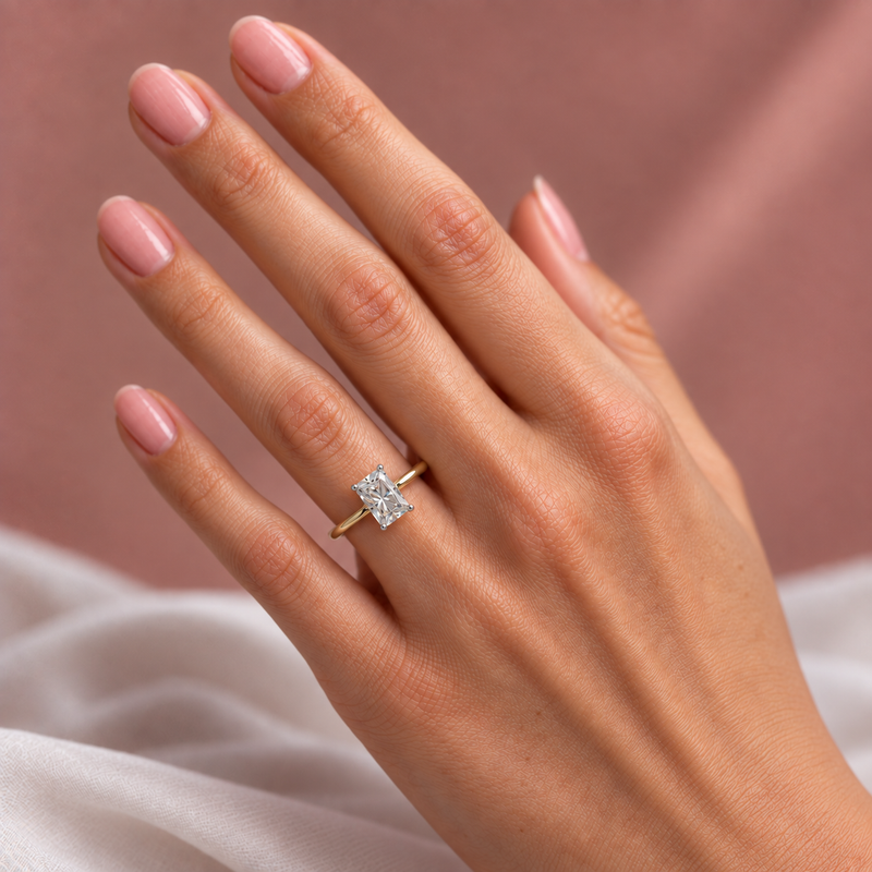 Two-tone 14K gold engagement ring featuring a 2 carat radiant-cut lab grown diamond with four white gold prongs and a polished gold band.