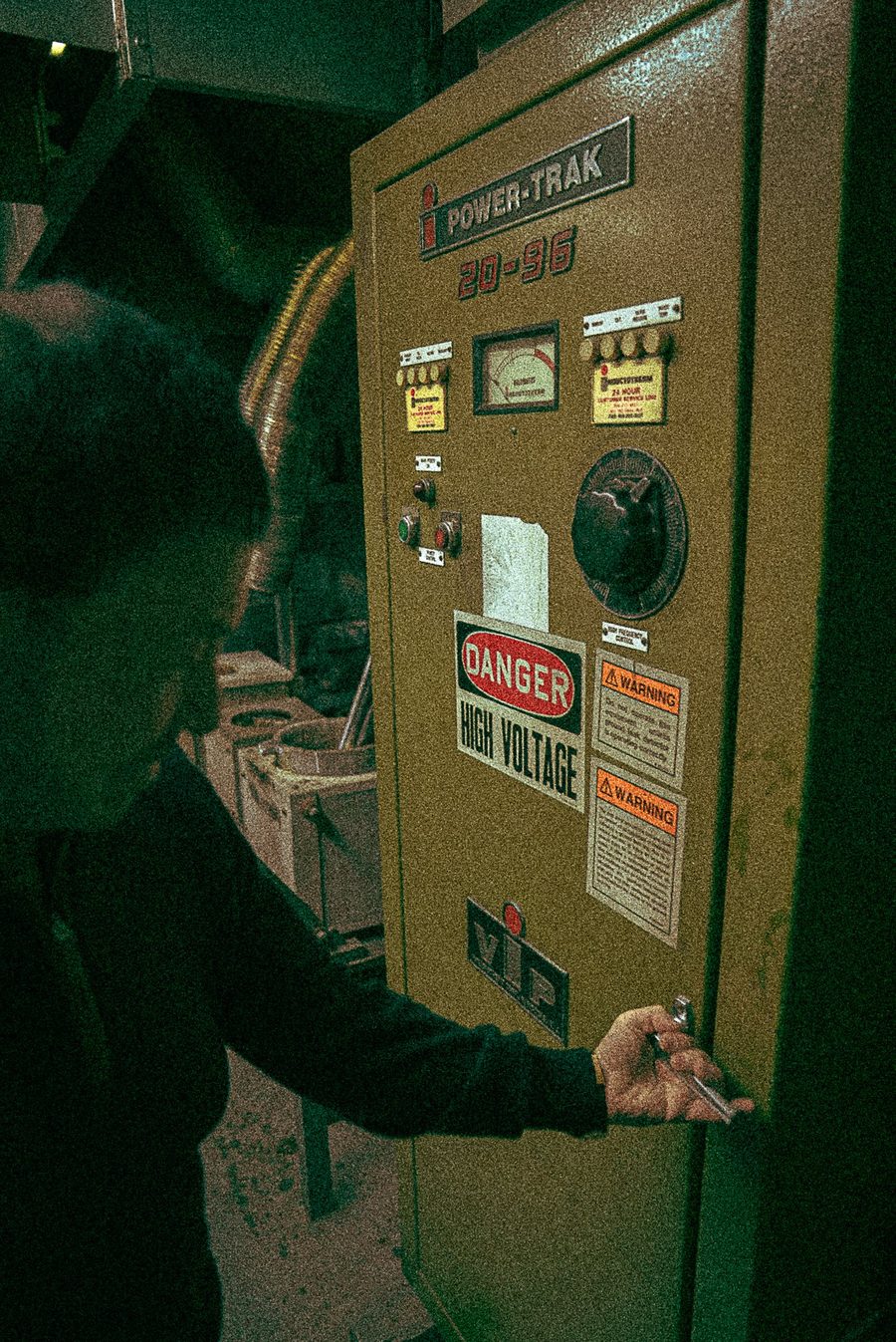 The Power-Trak furnace starter cabinet with high-voltage warning signs