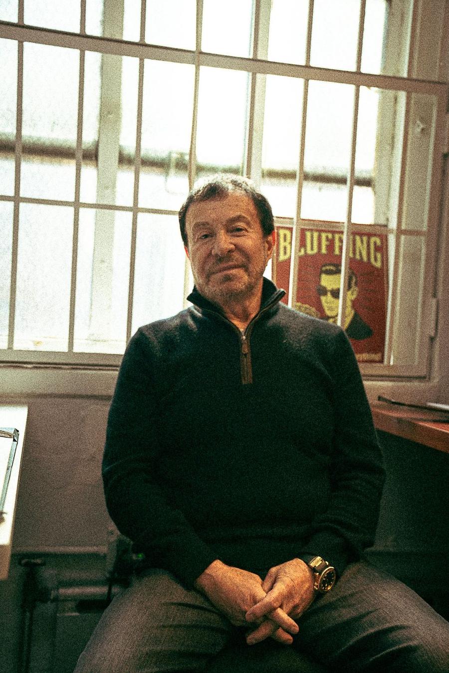 Michael, gold refiner, by a barred window