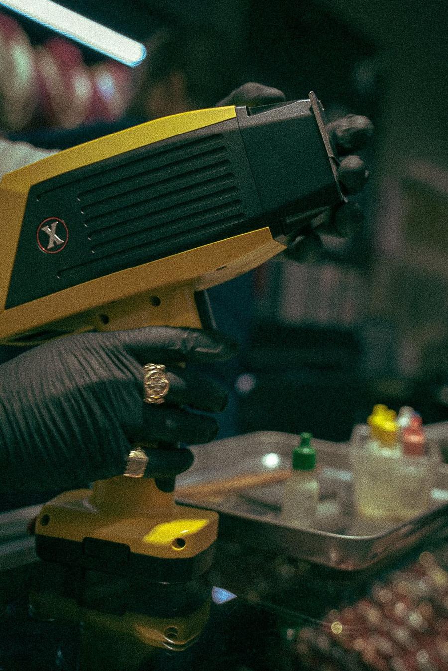 A handheld analyzer reading the metal
